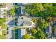 Aerial view of a home with manicured backyard and landscaped yard with driveway at 909 N Gregson St, Durham, NC 27701