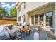 Inviting backyard patio with stylish furniture and manicured lawn, perfect for outdoor entertaining at 909 N Gregson St, Durham, NC 27701