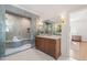 Beautiful bathroom with a modern shower and wood vanity with marble countertops at 909 N Gregson St, Durham, NC 27701