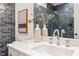 Close-up on bathroom vanity featuring white marble and decorative accents at 909 N Gregson St, Durham, NC 27701
