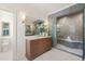 Elegant bathroom featuring a tiled shower, marble countertop, and stylish fixtures at 909 N Gregson St, Durham, NC 27701