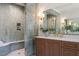 Elegant bathroom featuring a tiled shower, marble countertop, and stylish fixtures at 909 N Gregson St, Durham, NC 27701