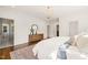 Stylish bedroom with hardwood floors, white bedding, and designer accents at 909 N Gregson St, Durham, NC 27701