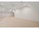 Spacious carpeted bonus room with sloped ceilings, recessed lighting, and neutral color palette at 909 N Gregson St, Durham, NC 27701