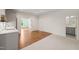 Bonus room with wood floors, neutral walls, and a view to a bathroom at 909 N Gregson St, Durham, NC 27701