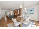Open concept living space with seamless flow between the kitchen and dining area; perfect for entertaining at 909 N Gregson St, Durham, NC 27701