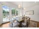 Dining Room features a backyard view, and a long hardwood table with seating for six at 909 N Gregson St, Durham, NC 27701