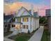 Elegant home with landscaped front yard and long driveway, offering curb appeal and convenience at 909 N Gregson St, Durham, NC 27701
