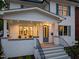 Charming front porch with seating, classic architectural details, and inviting entryway at 909 N Gregson St, Durham, NC 27701