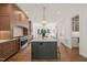 Spacious open-concept kitchen with stainless appliances, a large island, and barstool seating at 909 N Gregson St, Durham, NC 27701