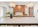 Bright kitchen with a large island, bar stool seating and modern pendant lights at 909 N Gregson St, Durham, NC 27701