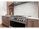 Stainless steel range and hood in a modern, updated kitchen at 909 N Gregson St, Durham, NC 27701