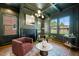 Beautiful living room featuring a fireplace, coffered ceiling and large windows at 909 N Gregson St, Durham, NC 27701