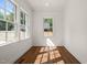 Bright office space with hardwood flooring, white trim, and large windows at 909 N Gregson St, Durham, NC 27701
