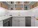 This elegant pantry has open shelving, quartz countertops, and stainless steel appliances at 909 N Gregson St, Durham, NC 27701