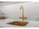 Close up of the butler pantry sink with custom faucet and natural stone countertops at 909 N Gregson St, Durham, NC 27701