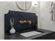 The stylish powder room features a vanity with a unique fixture and sink at 909 N Gregson St, Durham, NC 27701