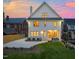 Manicured lawn and rear exterior view with patio seating and meticulous landscaping at 909 N Gregson St, Durham, NC 27701