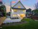 Stately rear exterior with lush landscaping and hardscape patio, perfect for enjoying the outdoors at 909 N Gregson St, Durham, NC 27701