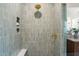 Modern tiled shower with a rainfall showerhead and built-in shelving at 909 N Gregson St, Durham, NC 27701