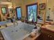 Bathroom featuring a large soaking tub and dual vanity at 915 Phils Creek Rd, Chapel Hill, NC 27516