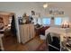 Bright bedroom with hardwood floors, white ceiling fan, many windows, and a comfortable layout at 915 Phils Creek Rd, Chapel Hill, NC 27516