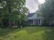 Well-manicured lawn with two homes visible in the background at 915 Phils Creek Rd, Chapel Hill, NC 27516