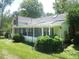 Charming home with a screened porch, a fenced yard, and mature trees, creating a peaceful retreat at 915 Phils Creek Rd, Chapel Hill, NC 27516
