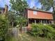 Charming two-story home with a well-maintained lawn and mature landscaping at 915 Phils Creek Rd, Chapel Hill, NC 27516