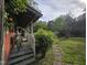 Inviting front porch with a quaint seating area and lush greenery at 915 Phils Creek Rd, Chapel Hill, NC 27516