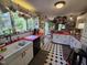 Bright kitchen features a red countertop, white cabinets and black and white flooring at 915 Phils Creek Rd, Chapel Hill, NC 27516
