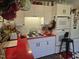 Well-lit kitchen with white cabinets, red countertop, and modern appliances at 915 Phils Creek Rd, Chapel Hill, NC 27516