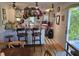 The kitchen features a unique island, tiled floor and decorative hanging pots and pans at 915 Phils Creek Rd, Chapel Hill, NC 27516