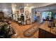 Spacious living room with hardwood floors, opening into a dining area and kitchen at 915 Phils Creek Rd, Chapel Hill, NC 27516