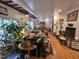 Spacious living room filled with plants, cozy seating, and unique decorative items at 915 Phils Creek Rd, Chapel Hill, NC 27516