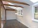 Light-filled living room with skylights, wood beams, hardwood floors, and modern pendant lighting at 915 Phils Creek Rd, Chapel Hill, NC 27516