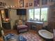 Inviting living room featuring natural light, rustic decor, and comfortable seating at 915 Phils Creek Rd, Chapel Hill, NC 27516