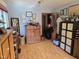 Room with wooden floors, blue walls, lots of windows, and wooden furniture and accessories at 915 Phils Creek Rd, Chapel Hill, NC 27516