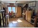 Room with wooden floors, lots of windows, and an array of wooden furniture at 915 Phils Creek Rd, Chapel Hill, NC 27516