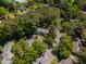 Scenic aerial view of a charming multi-Gathering home nestled among lush, mature trees and convenient parking at 102 Rosebrooks Dr, Cary, NC 27513
