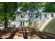 Private backyard featuring a well-maintained lawn, mature trees, and a wooden fence for added privacy at 102 Rosebrooks Dr, Cary, NC 27513