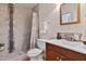 Modern bathroom featuring a tiled shower with a glass door and a vanity with sleek fixtures at 102 Rosebrooks Dr, Cary, NC 27513