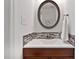 Stylish bathroom featuring a decorative mirror, modern sink, and tiled backsplash, creating an elegant space at 102 Rosebrooks Dr, Cary, NC 27513