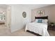 Cozy bedroom featuring soft carpet, a comfortable bed with decorative pillows, and ample closet space at 102 Rosebrooks Dr, Cary, NC 27513