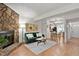 Open floor plan seamlessly connects the living room with a stone fireplace and modern kitchen at 102 Rosebrooks Dr, Cary, NC 27513