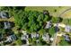 Aerial view of a residential neighborhood showcasing homes with mature trees and landscaping at 104 Crossway Ln, Holly Springs, NC 27540