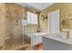 Elegant bathroom featuring a shower, soaking tub, and modern tile work at 104 Crossway Ln, Holly Springs, NC 27540