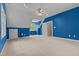 Spacious bedroom with carpet, ceiling fan, and ample natural light at 104 Crossway Ln, Holly Springs, NC 27540