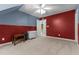 Bedroom boasting neutral carpet, with a door leading to a staircase and an additional hall closet at 104 Crossway Ln, Holly Springs, NC 27540