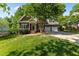 Charming brick home featuring a well-manicured lawn and a two-car garage with basketball goal at 104 Crossway Ln, Holly Springs, NC 27540